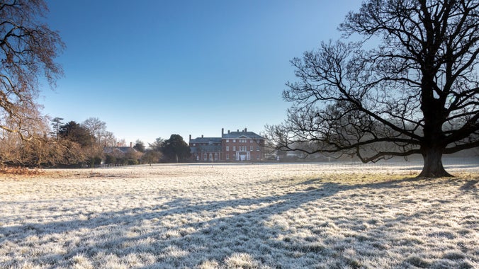 Frosty view of Hatchlands Park with the house in the distance